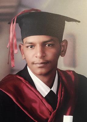 Portrait of my late cousin, Moayyad Ibrahim Mohammad Musa, who is pictured wearing a cap and gown for his college graduation. Moayyad died in the summer of 2023 while desperately trying to escape the raging conflict in Sudan.